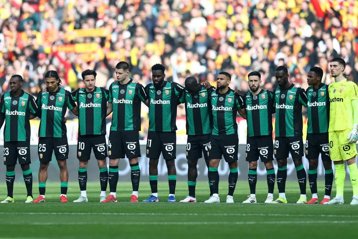 FILE PHOTO: Soccer Football - Ligue 1 - RC Lens v FC Metz - Stade Bollaert-Delelis, Lens, France - March 8, 2026 RC Lens players line up before the match. REUTERS/Stephane Mahe/File Photo