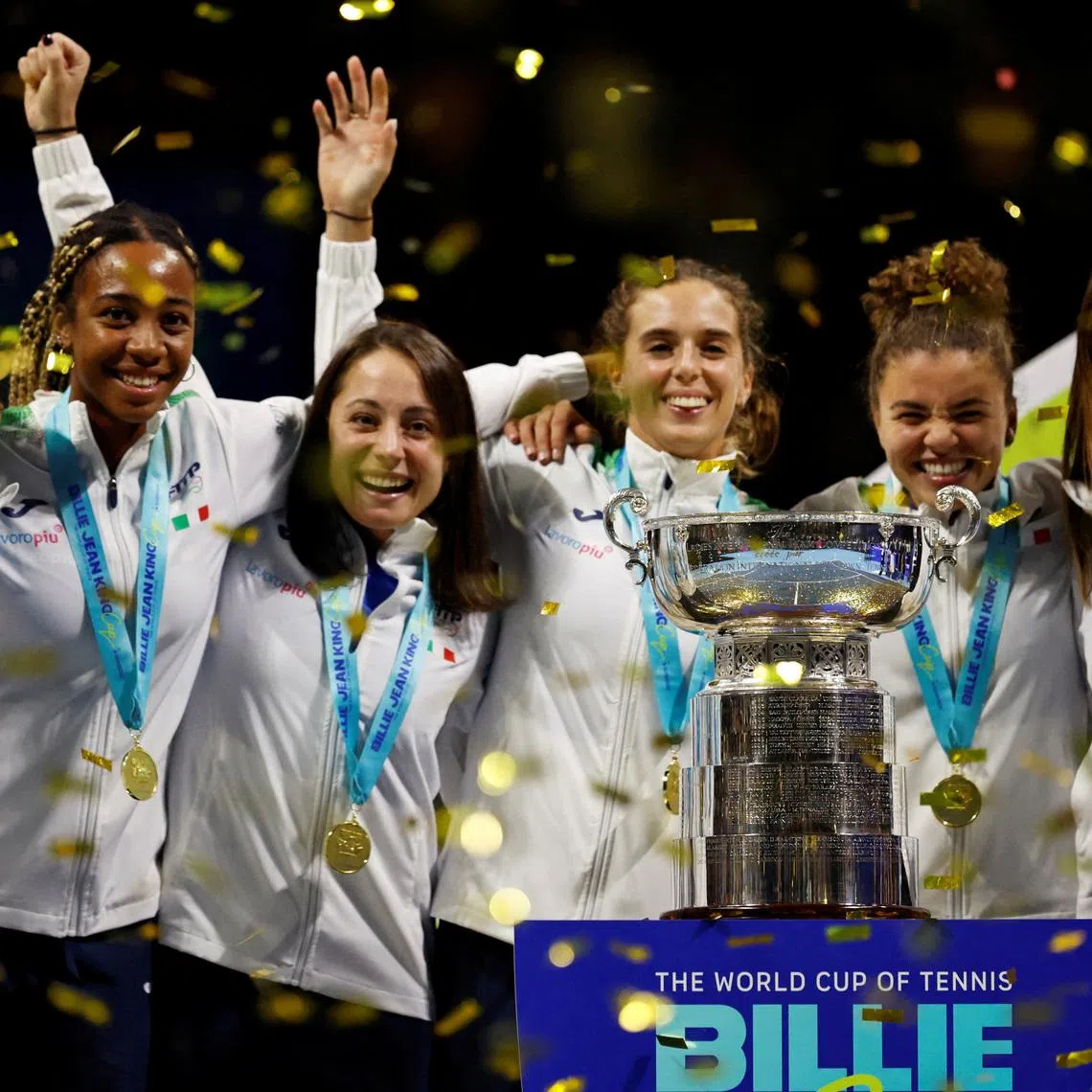 FILE PHOTO: Tennis - Billie Jean King Cup Finals - Final - Italy v United States - Shenzhen Bay Sports Centre Arena, Shenzhen, China - September 21, 2025 Italy's Jasmine Paolini, Lucia Bronzetti, Elisabetta Cocciaretto, Tyra Grant, Sara Errani and captain Tathiana Garbin celebrate with the trophy after winning the final REUTERS/Tingshu Wang/File Photo