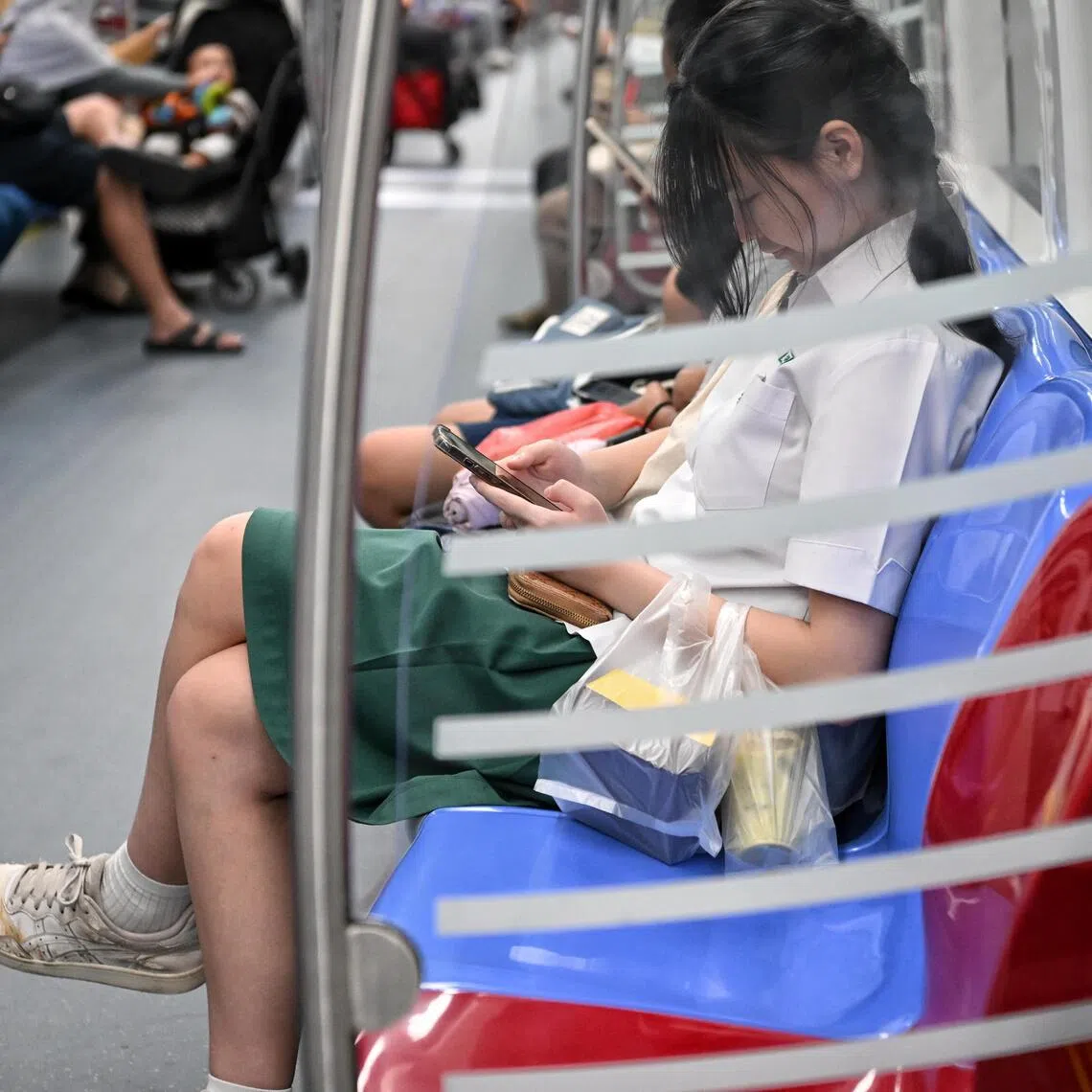 ST20230922_202339766261 Kua Chee Siong/ pixgeneric/ Generic pix of a student using her mobile phone/ handphone on the train on Sept 22, 2023.