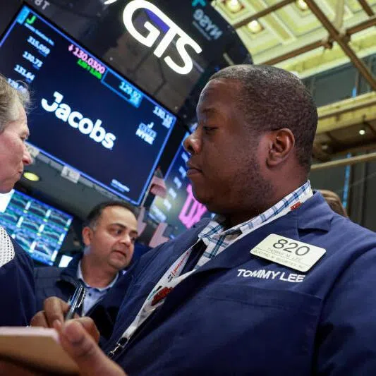 Traders work on the floor at the New York Stock Exchange in New York City on March 23.