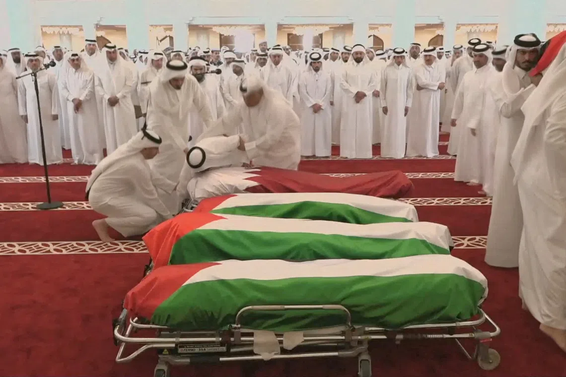 FILE PHOTO: People attend a funeral held for those killed by an Israeli attack in Doha, including Corporal Badr Saad Mohammed Al-Humaidi Al-Dosari, a member of the Internal Security Force, at the Sheikh Mohammed bin Abdul Wahhab Mosque in Doha, Qatar, September 11, 2025, in this screengrab obtained from a video feed. Qatar TV/Reuters TV via REUTERS./File Photo