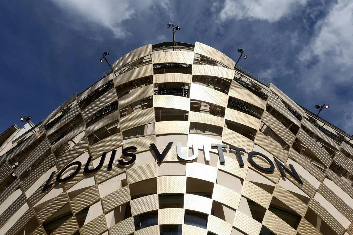 FILE PHOTO: A logo of Louis Vuitton is seen on a store of luxury retailer Louis Vuitton on the Champs-Elysees avenue in Paris, France, April 15, 2024. REUTERS/Manon Cruz//File Photo