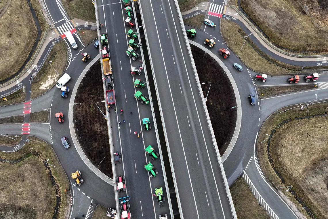 Polish farmers with their tractors and vehicles blocking the highway linking Warsaw and Lublin outside the town of Ryki, Lublin region, during a protest of farmers across the country againts EU climate measures on Feb 20, 2024.