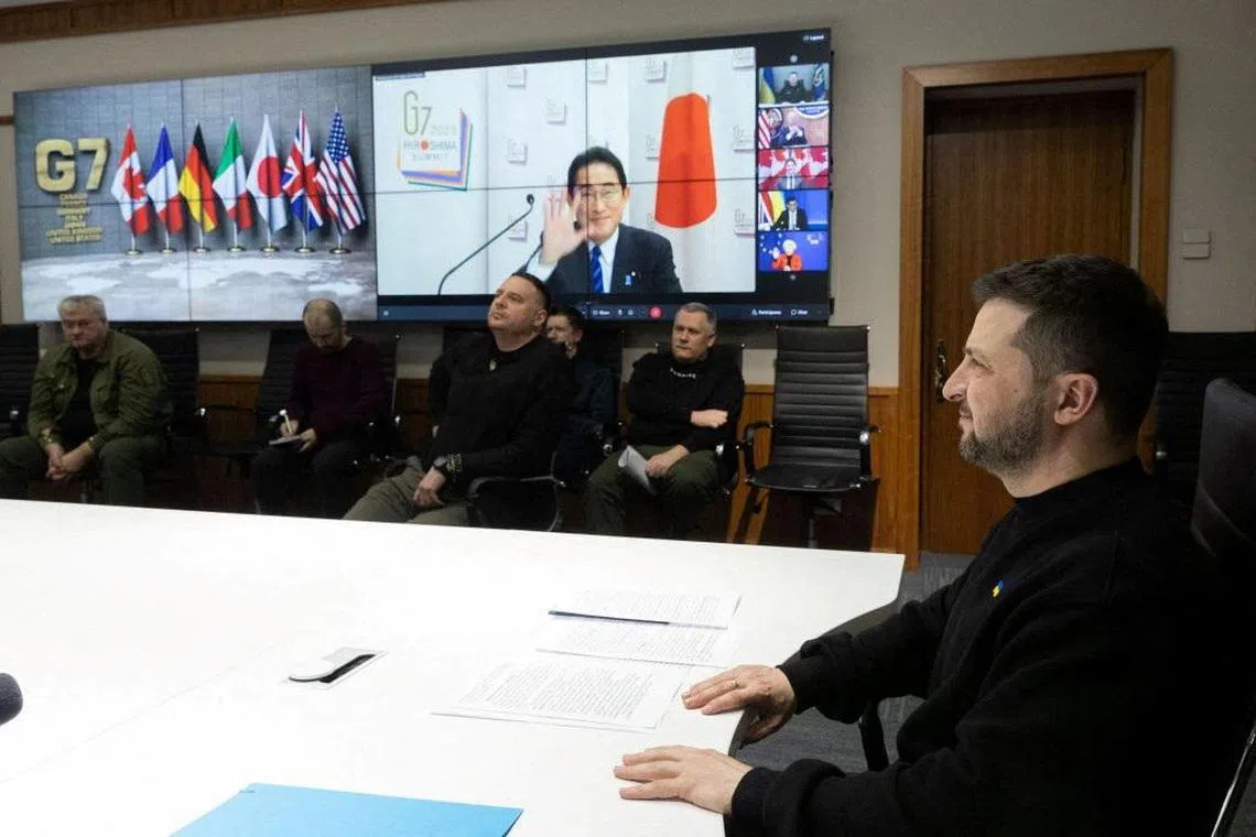 Ukraine's President Volodymyr Zelensky attends a working session of G-7 leaders via video link, on Feb 24, 2023.