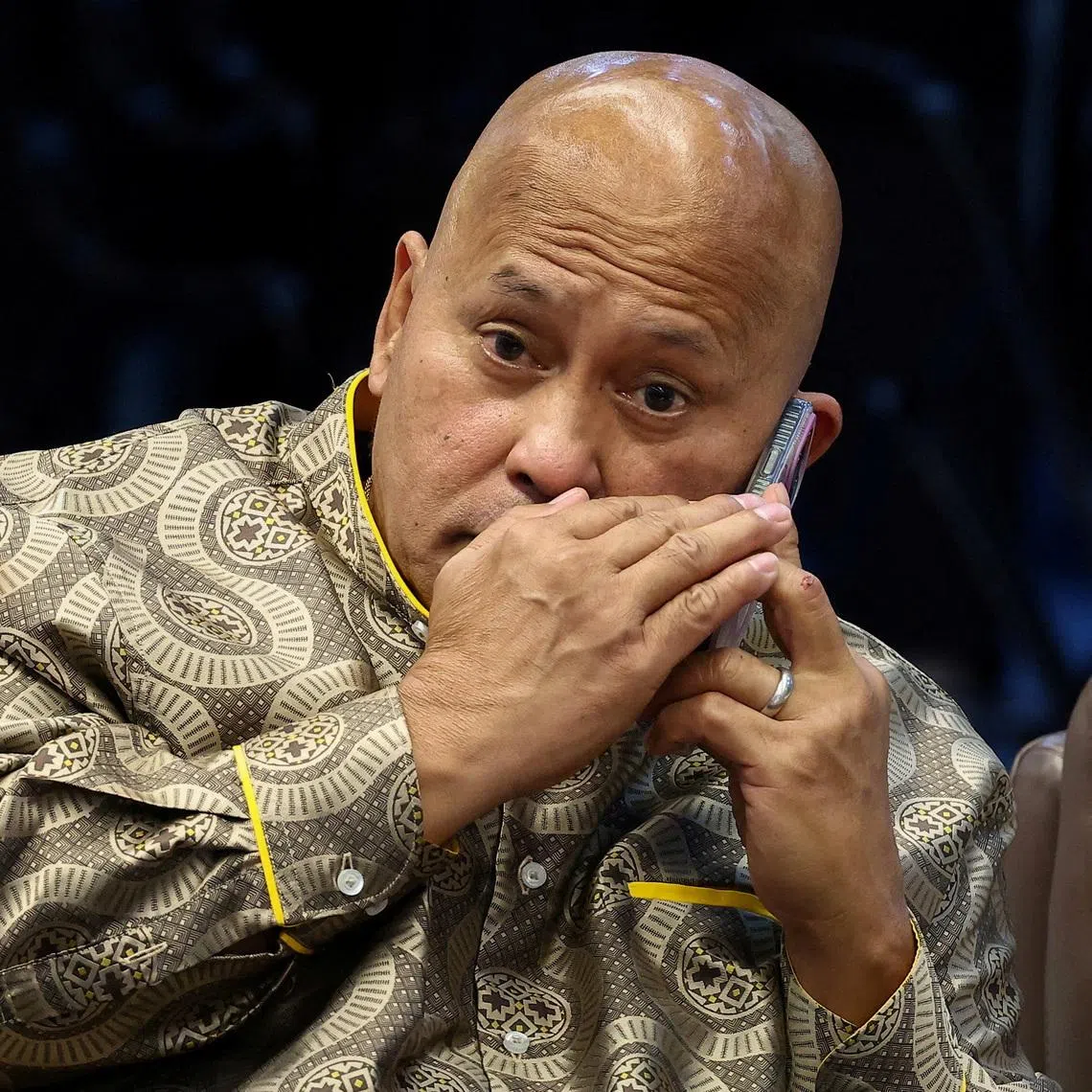 FILE PHOTO: Philippine Senator Ronald \"Bato\" dela Rosa, the chief enforcer of former president Rodrigo Duterte's drug war, takes a phone call during a session at the Senate, which holds him under protective custody amid an International Criminal Court warrant, in Pasay City, Metro Manila, Philippines, May 13, 2026. REUTERS/Eloisa Lopez/File Photo
