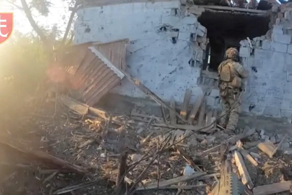 Soldiers carry out stabilization operations in the village of Staromayorske, Donetsk Region, Ukraine in this screengrab taken from a social media video released on July 28, 2023. 35th Separate Marines Brigade of the Ukrainian Armed Forces via REUTERS/File Photo