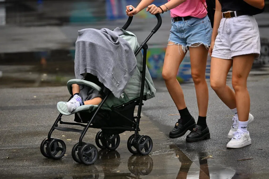 Generic photo of a baby being pushed in a covered pram protected from the rain on March 6, 2023. 
can be used for children, kids, stories. 