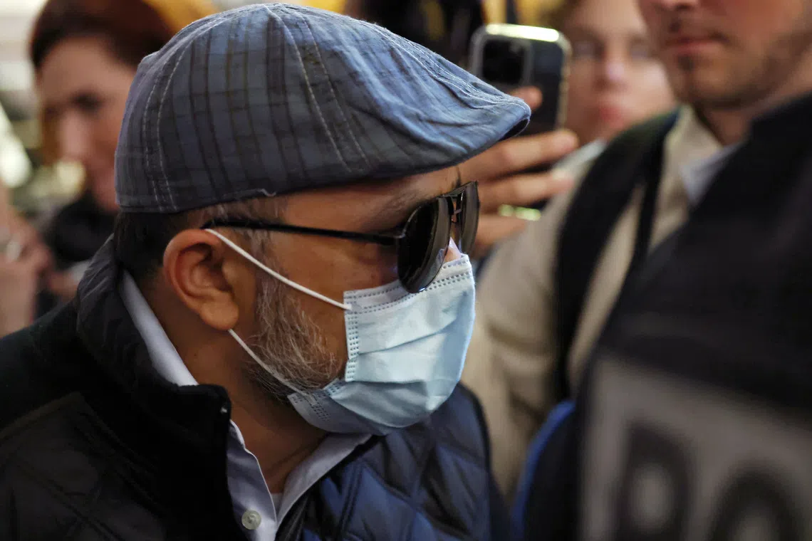 Husamettin D., one of the 51 people convicted in the rape trial of French woman Gisele Pelicot, who was the victim of a mass rape orchestrated by her then-husband Dominique Pelicot at their home in the southern French town of Mazan, wearing a mask and sunglasses, sits in the courtroom to attend a hearing in his appeal trial at the courthouse in Nimes, France, October 8, 2025. REUTERS/Manon Cruz