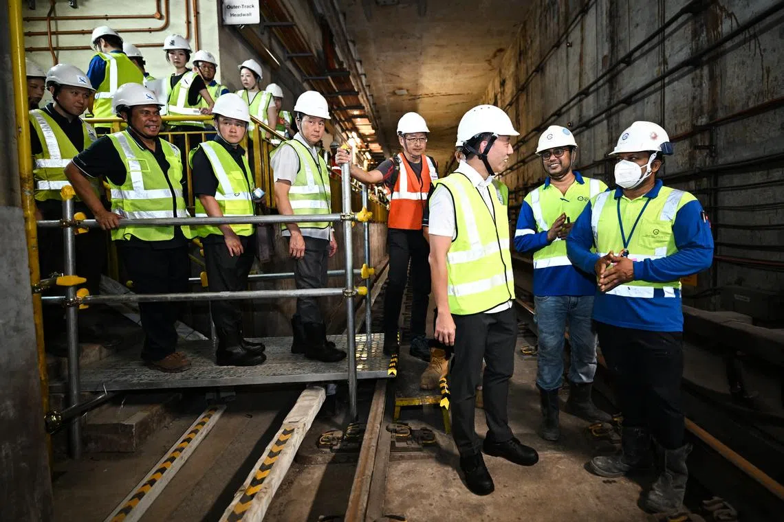 Acting Transport Minister Jeffrey Siow (third from right) inside the tunnel at Dakota MRT station during an update on progress of Circle Line tunnel strengthening works on March 26.