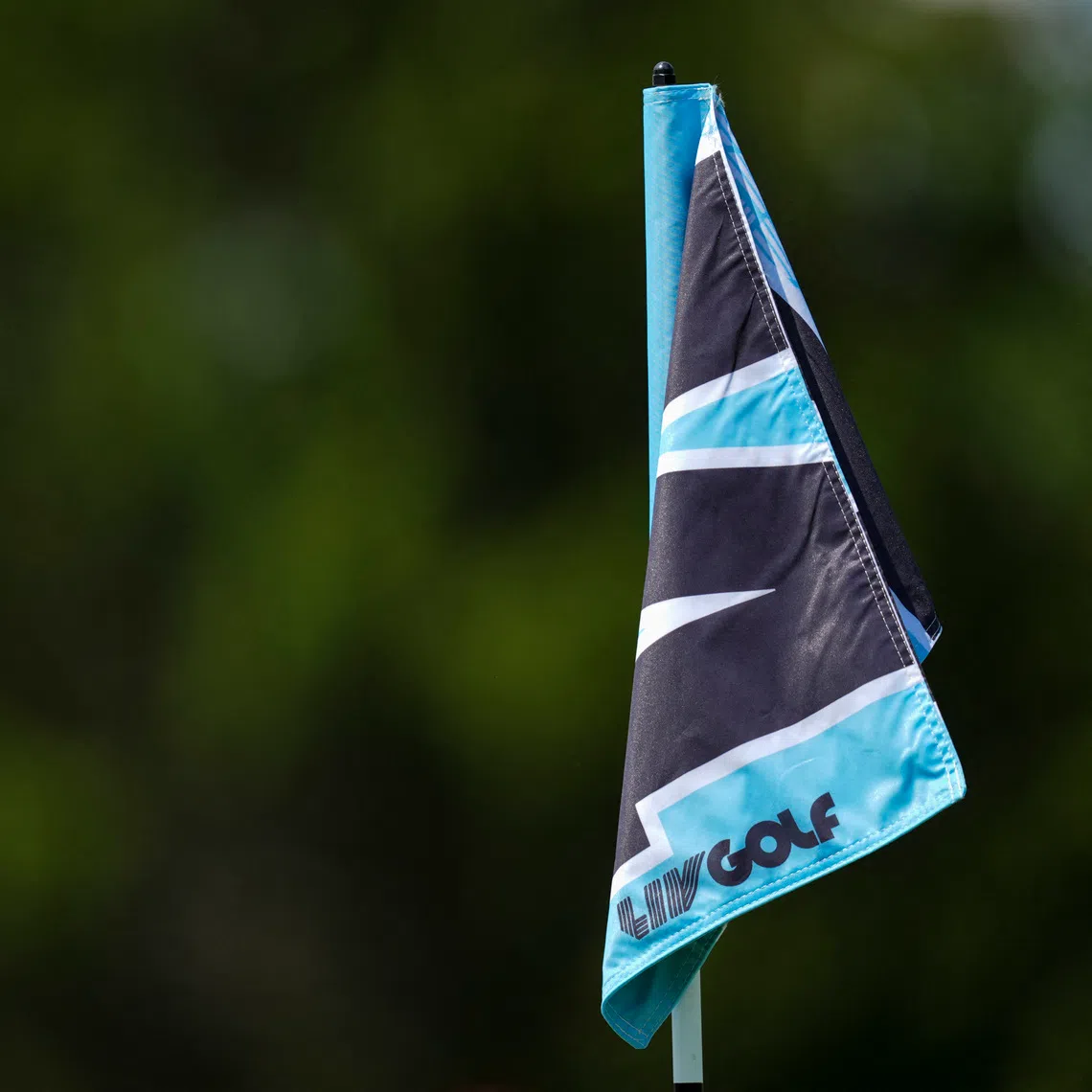 Aug 22, 2025; Detroit, Michigan, USA;  The LIV Golf logo is seen on the 14th green pin flag during the quarterfinals of the LIV Golf Michigan Team Championship at The Cardinal at Saint John's Resort. Mandatory Credit: Aaron Doster-Imagn Images