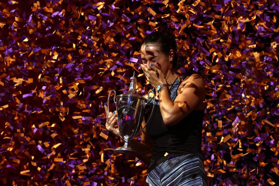 Caroline Garcia of France celebrates with the Billie Jean King Trophy during the 2022 WTA Finals on Nov 7, 2022. 