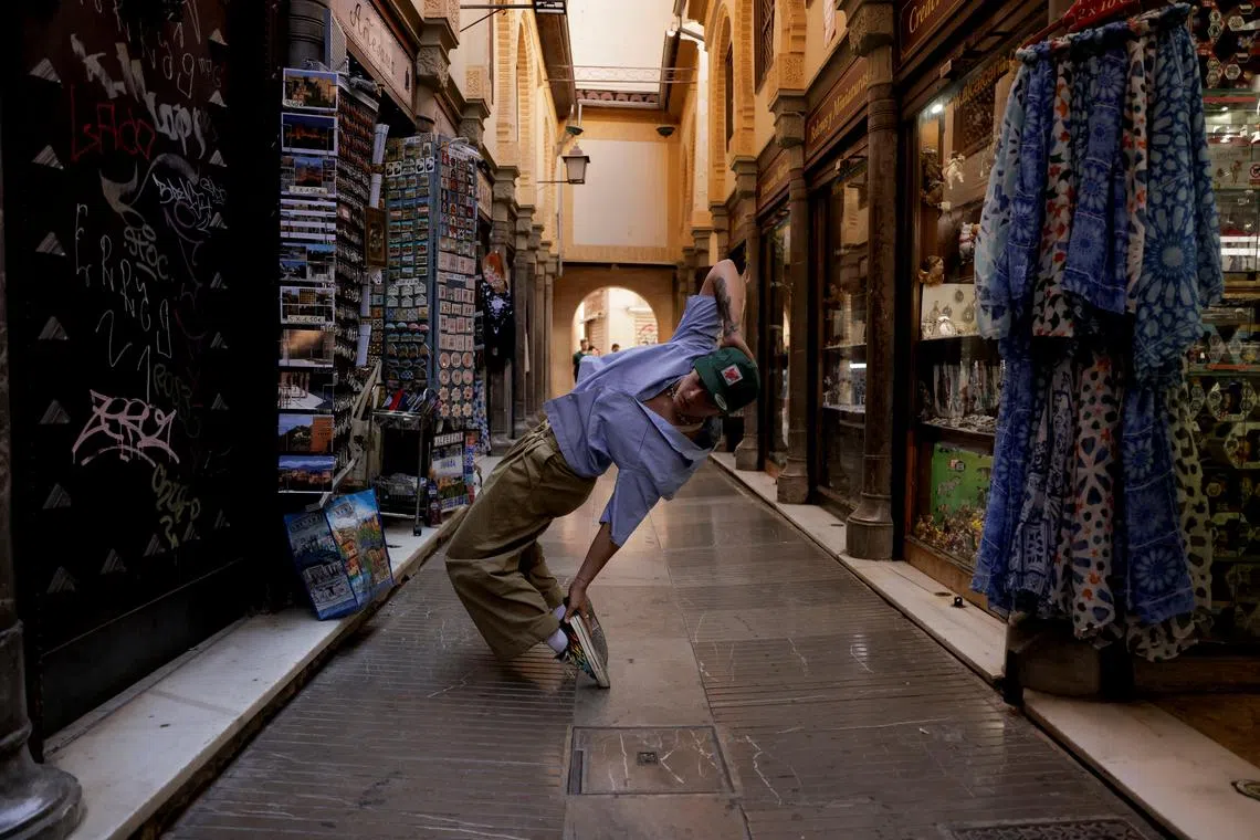 FILE PHOTO: Spanish breakdancer Laura Garcia, 29, (B-Girl RawLaw) performs on a street, in downtown Granada, Spain, July 22, 2024. REUTERS/Jon Nazca/File Photo