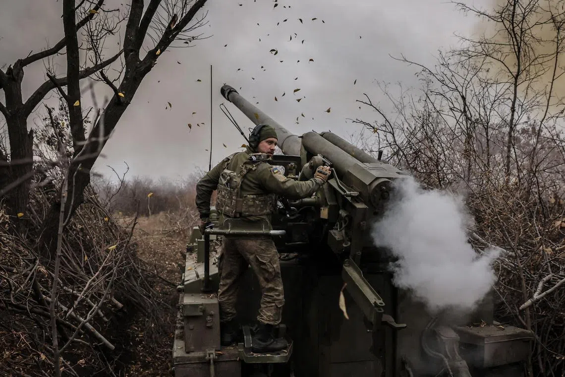 A Ukrainian serviceman firing a self-propelled howitzer towards Russian positions near Chasiv Yar, in Ukraine's Donetsk region, in November 2024.