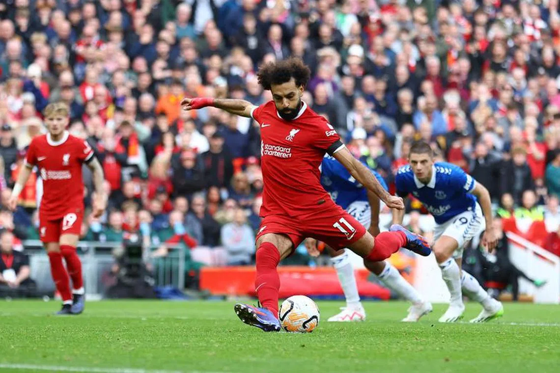 Soccer Football - Premier League - Liverpool v Everton - Anfield, Liverpool, Britain - October 21, 2023  Liverpool's Mohamed Salah scores their first goal from the penalty spot REUTERS/Carl Recine