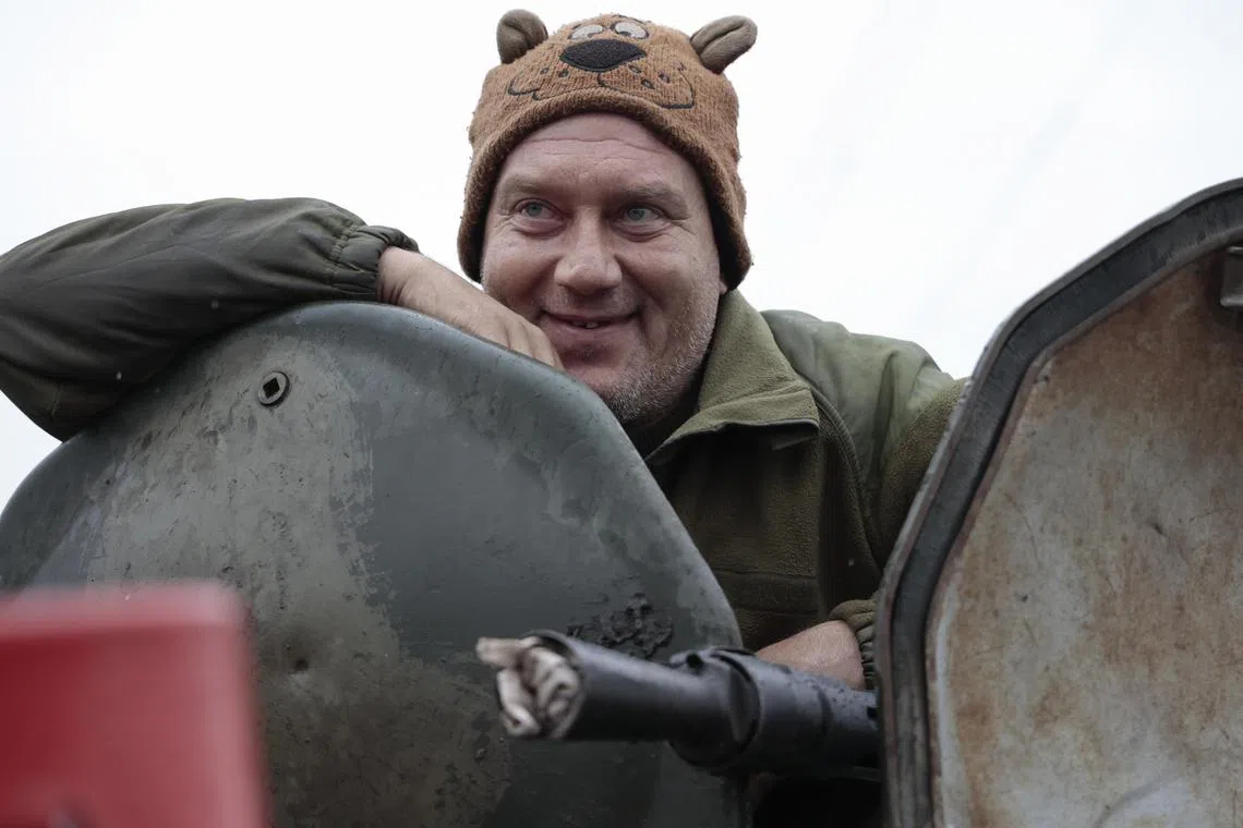 A pro-Russian fighter looks on from an armoured personnel carrier at a position not far from Avdeevka, in Ukraine's Donetsk region, on Nov 22, 2022.