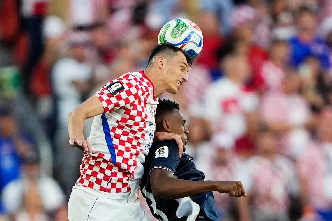Soccer Football - FIFA World Cup 2026 - Group L - Panama v Croatia - Toronto Stadium, Toronto, Canada - June 23, 2026 Croatia's Ante Budimir in action with Panama's Jiovany Ramos IMAGN IMAGES via Reuters/Kevin Sousa