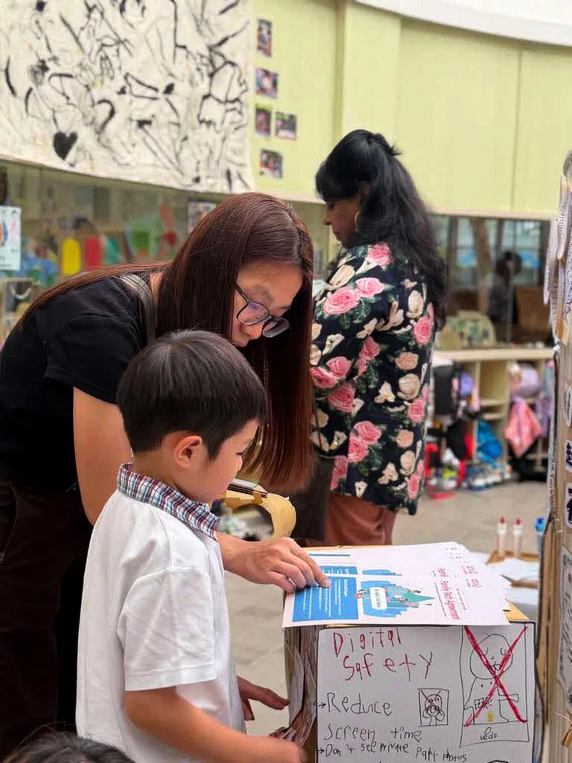 A Celebration of Learning event at an E-Bridge pre-school centre, where parents were shared the IMDA materials used to teach their children of online safety and usage limits.