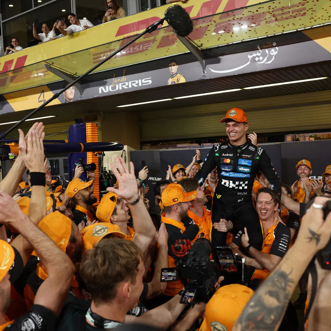 Formula One F1 - Abu Dhabi Grand Prix - Yas Marina Circuit, Abu Dhabi, United Arab Emirates - December 7, 2025 McLaren's Lando Norris celebrates with his team after becoming the 2025 Formula One World Champion REUTERS/Amr Alfiky
