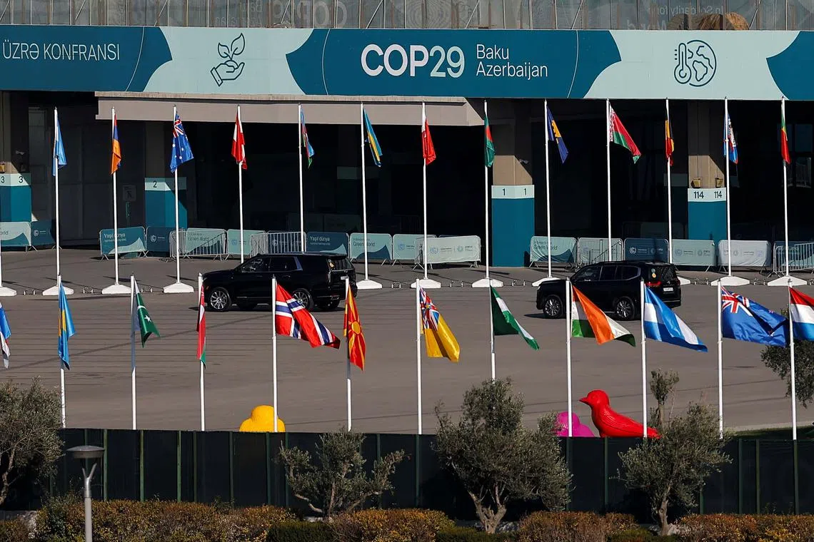 Cars drive at the territory of the COP29 United Nations climate change conference venue, in Baku, Azerbaijan November 22, 2024. REUTERS/Maxim Shemetov
