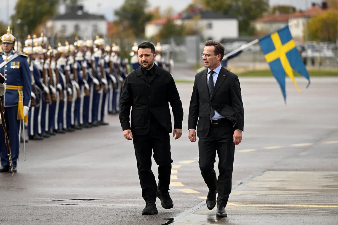 Ukrainian President Volodymyr Zelensky (left) and Sweden's Prime Minister Ulf Kristersson in Linkoping, Sweden, on Oct 22.
