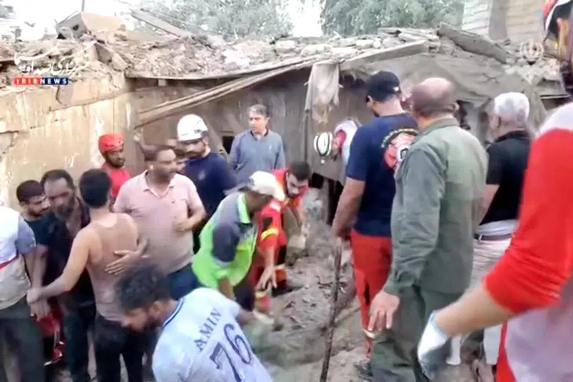 Rescuers clear rubble to search for victims following a US strike in Qeshm island, Iran, on July 30.