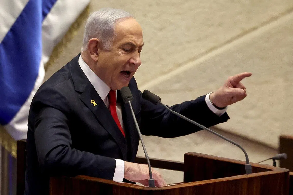 FILE PHOTO: Israeli Prime Minister Benjamin Netanyahu speaks at the plenum, during a discussion on the subject of hostages kidnapped during the deadly October 7, 2023 attack, in Israel's parliament, the Knesset, in Jerusalem, November 18, 2024. REUTERS/Ronen Zvulun/File Photo