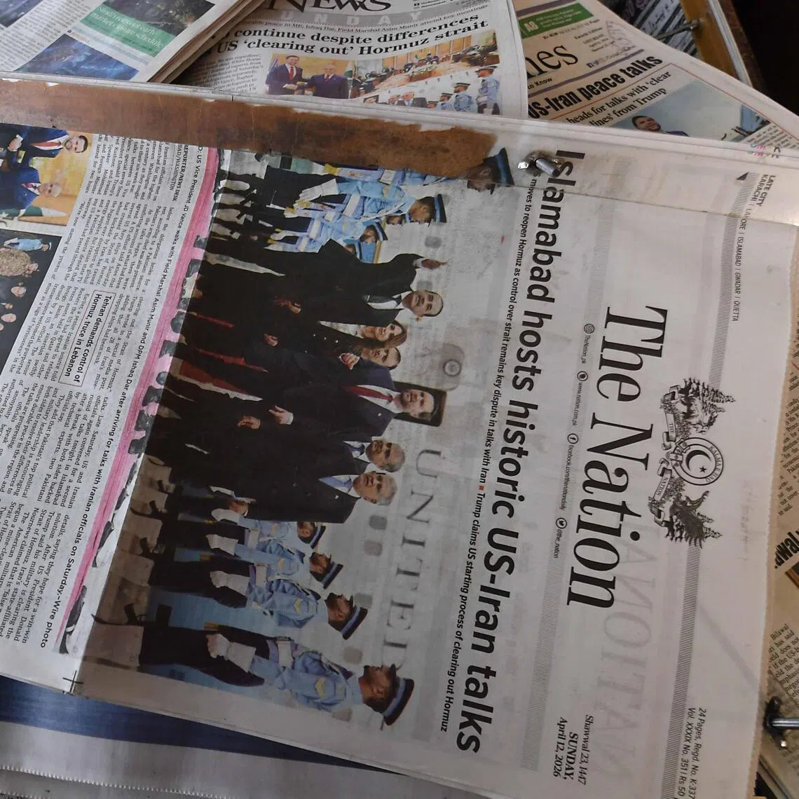 Newspapers are displayed after US-Iran peace talks Pakistan, on April 12, 2026, after Iran and the US failed to reach an agreement after peace talks held in Islamabad a day before.