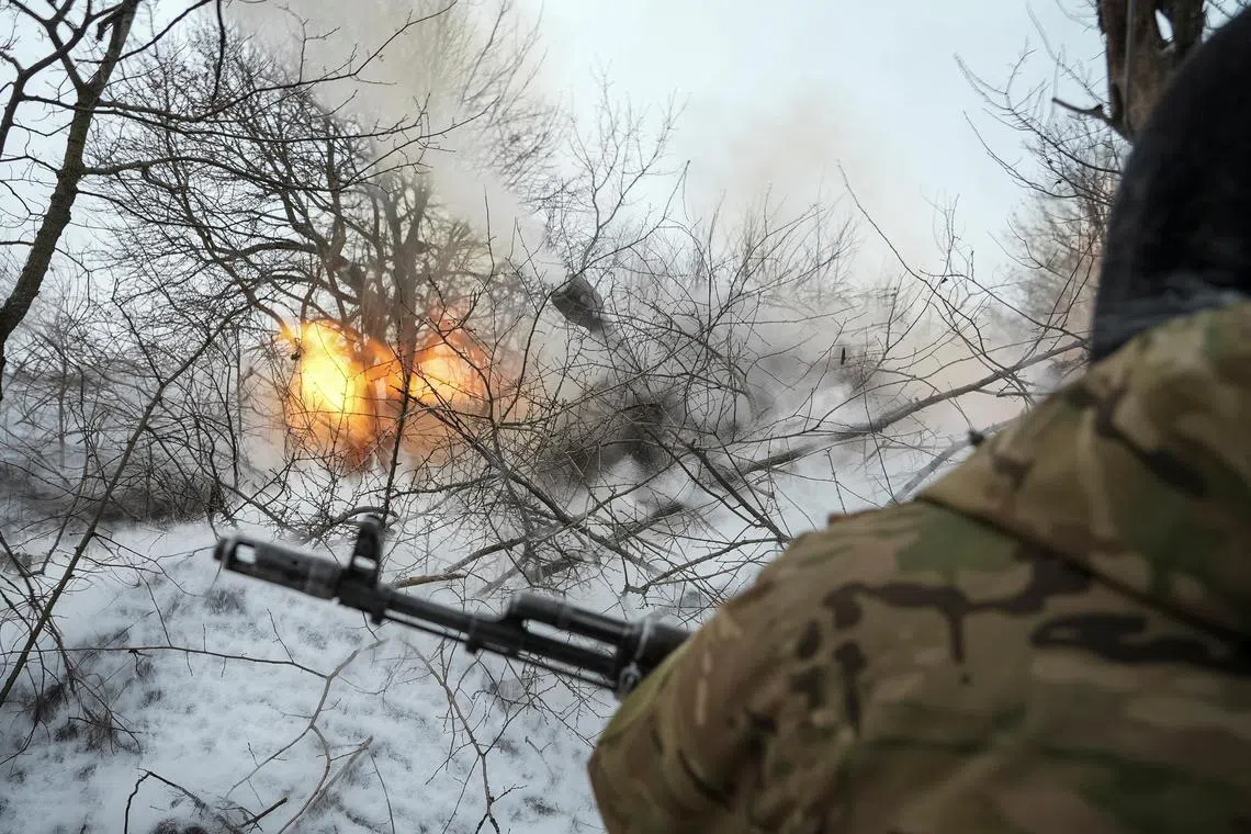 Ukrainian servicemen fire a self-propelled howitzer towards Russian troops, near the town of Chasiv Yar in Ukraine's Donetsk region.
