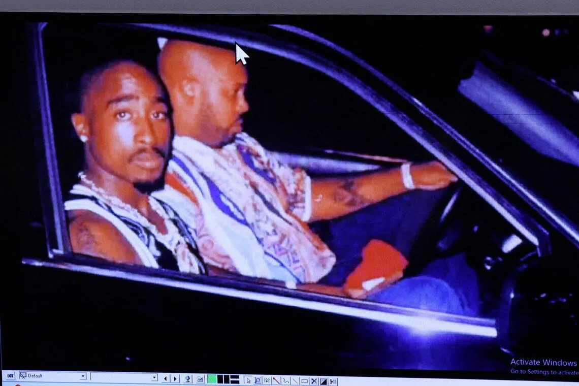 A photograph of rapper Tupac Shakur (left), taken just minutes before the fatal shooting, displayed during the murder trial.