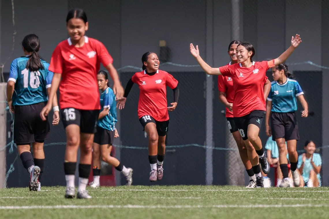 Bowen Secondary’s vice-captain Emilie Tan (right) encouraging her teammates after scoring against CBP W3.