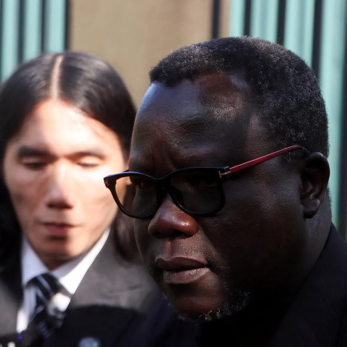 Ambassador Agok Anyar, spokesperson for South Sudan's Ministry of Foreign Affairs and International Cooperation, attends a press conference with Vietnamese deportee Thanh Tuan Phan as Thanh departs Juba after nearly a year in the country, at Juba International Airport, South Sudan, June 19, 2026. REUTERS/Samir Bol