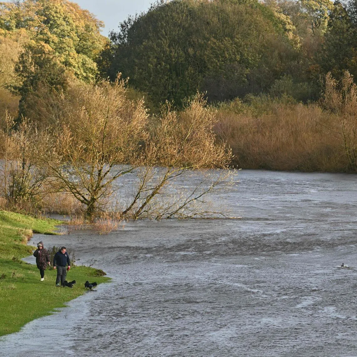 River Eden in Carlisle, north-west England, swollen on Oct 25. Hundreds of flights were cancelled or diverted because of storms across northern Europe.