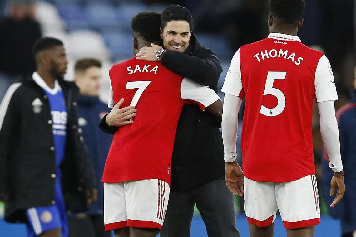 Arsenal manager Mikel Arteta celebrates with Bukayo Saka after the 1-0 win over Leicester.