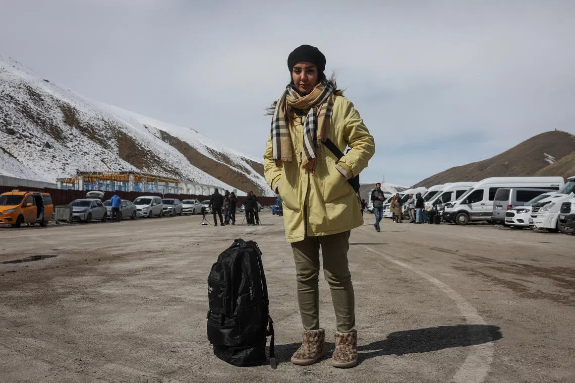 Leila, 45, from Shiraz, Iran, poses for a portrait ahead of crossing from Turkey into Iran, in Van province, Turkey, on March 6.