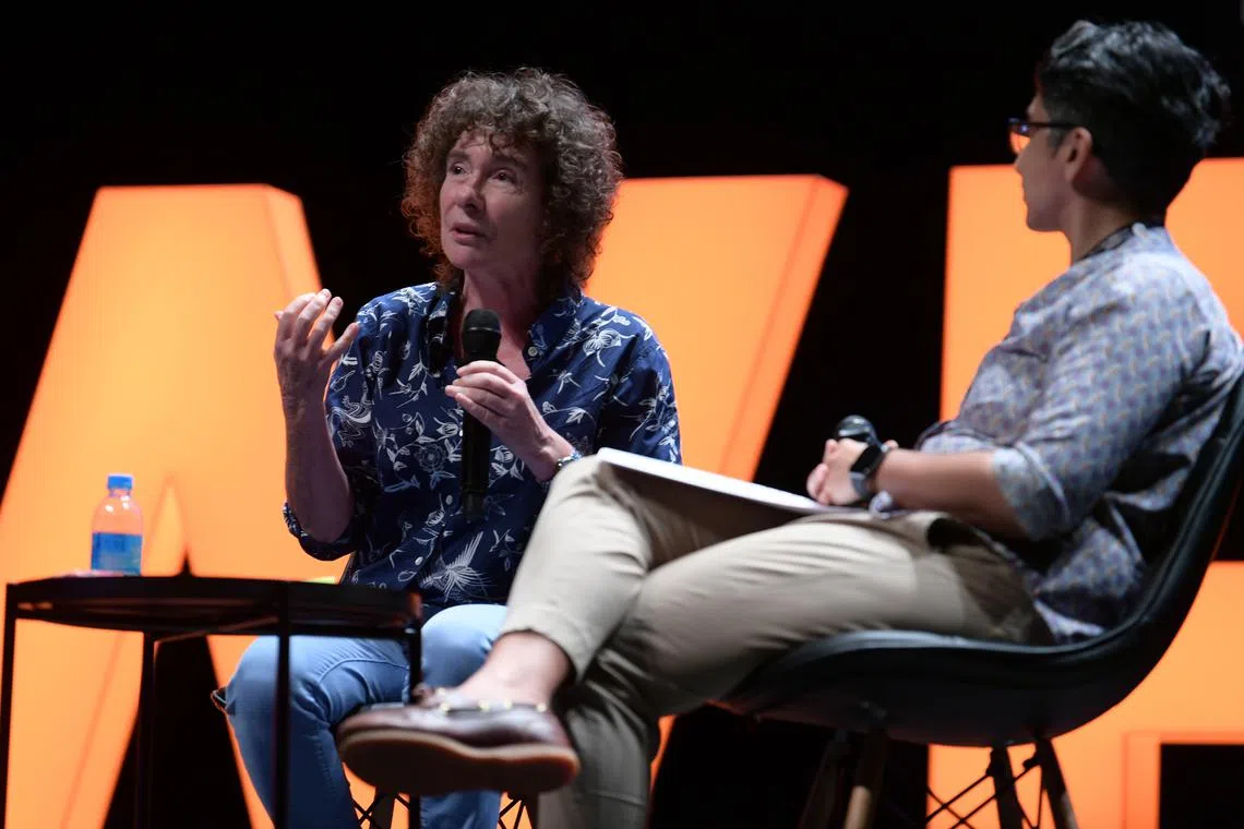 Acclaimed British author Jeanette Winterson delivering her speech titled If We Can Imagine It at the Singapore Writers Festival. On the right is moderator Mrigaa Sethi. 