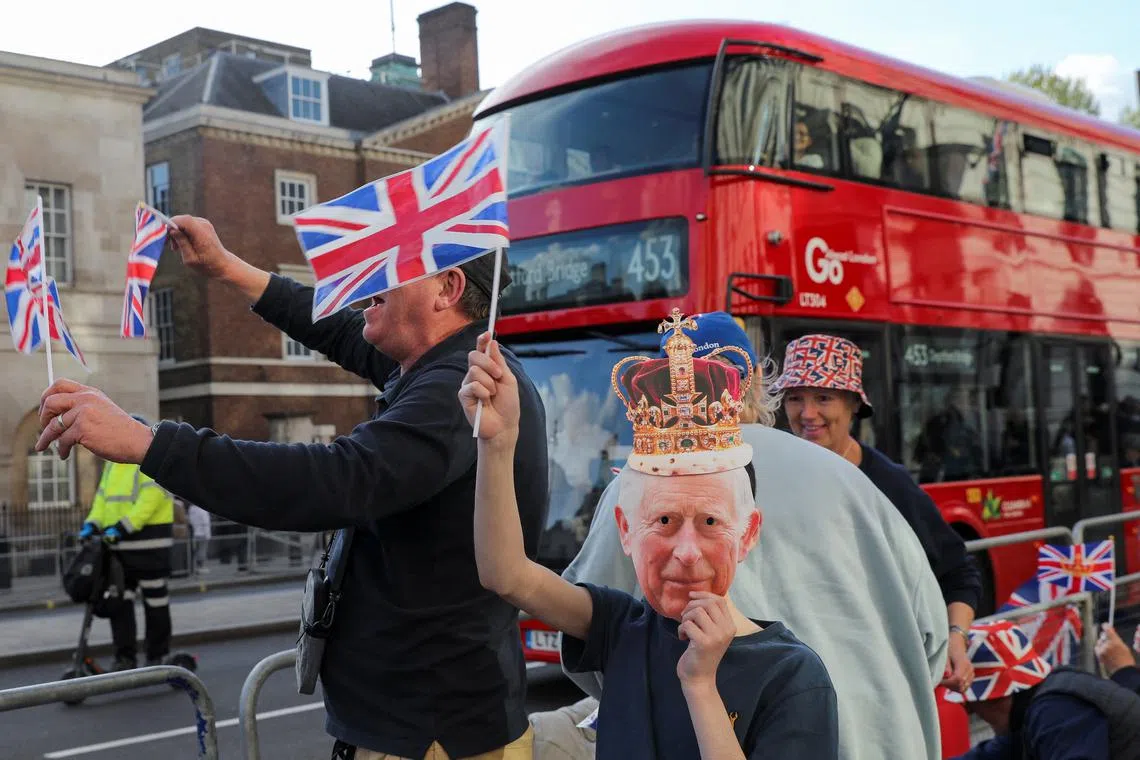 Well-wishers gathering along the path that Britain's King Charles and Queen Consort Camilla will travel during the procession marking their coronation along the main streets of London, Britain, May 5.