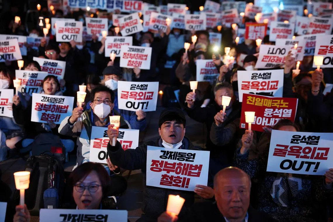 A candlelight vigil that denounces the government's proposal in Seoul, South Korea, on March 6, 2023. 