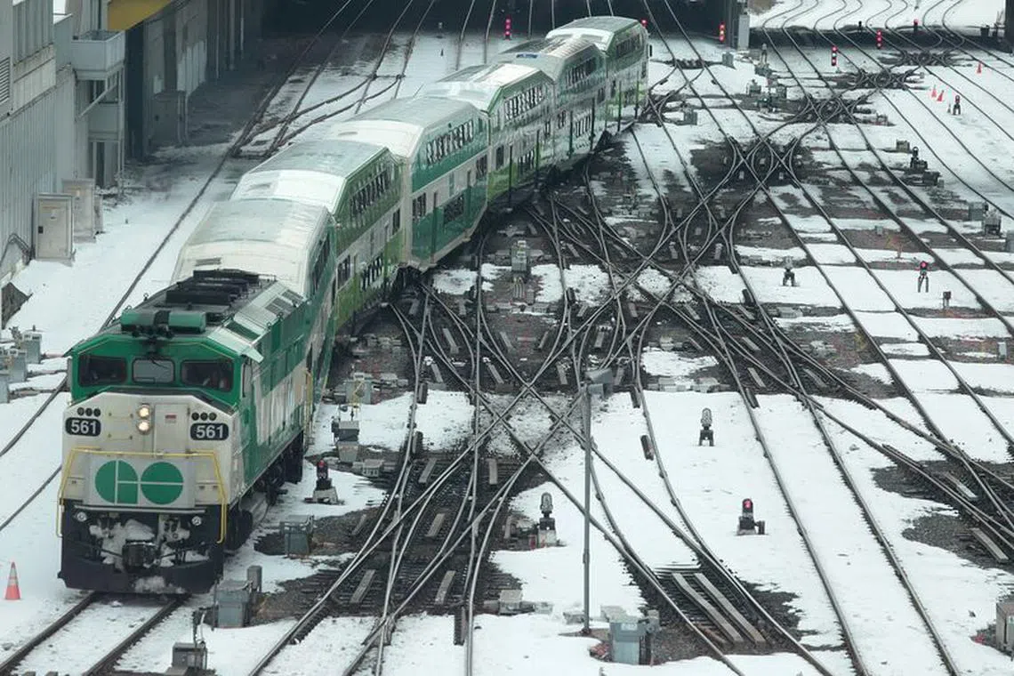 FILE PHOTO: A GO commuter train approaches Union Station after two days of snow in Toronto, Ontario, Canada, February 14, 2019. REUTERS/Chris Helgren/File Photo