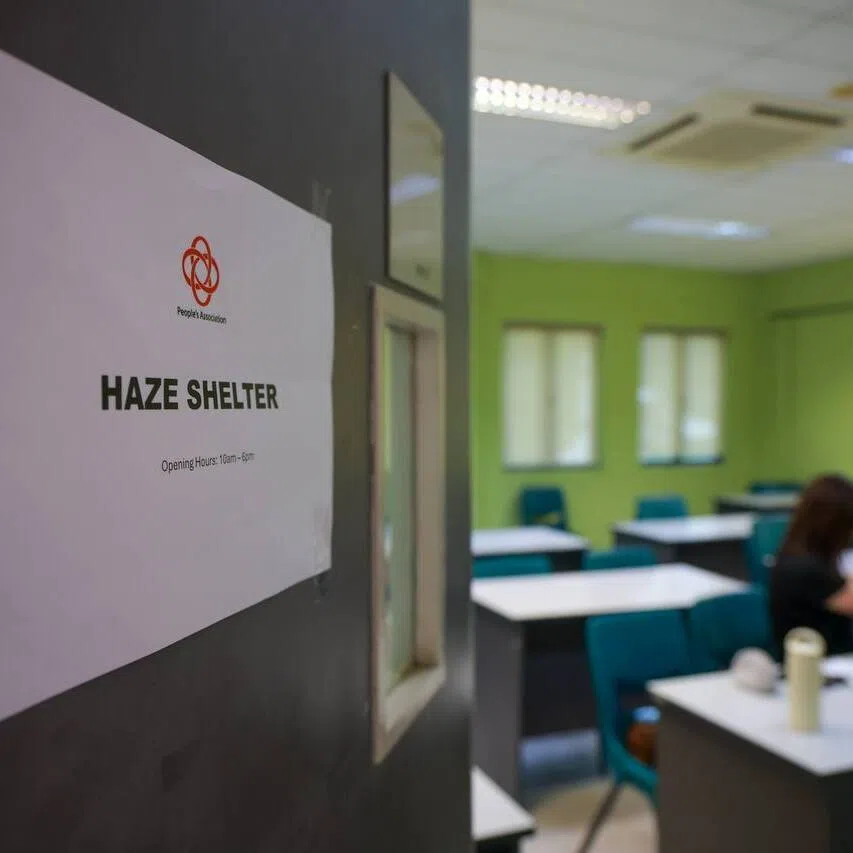 People’s Association staff working in the haze shelter at Kallang CC on Oct 15.