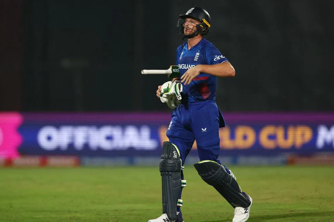 Cricket - ICC Cricket World Cup 2023 - England v Afghanistan - Arun Jaitley Stadium, New Delhi, India - October 15, 2023 England's Jos Buttler walks after losing his wicket, bowled out by Afghanistan's Naveen-Ul-Haq REUTERS/Andrew Boyers