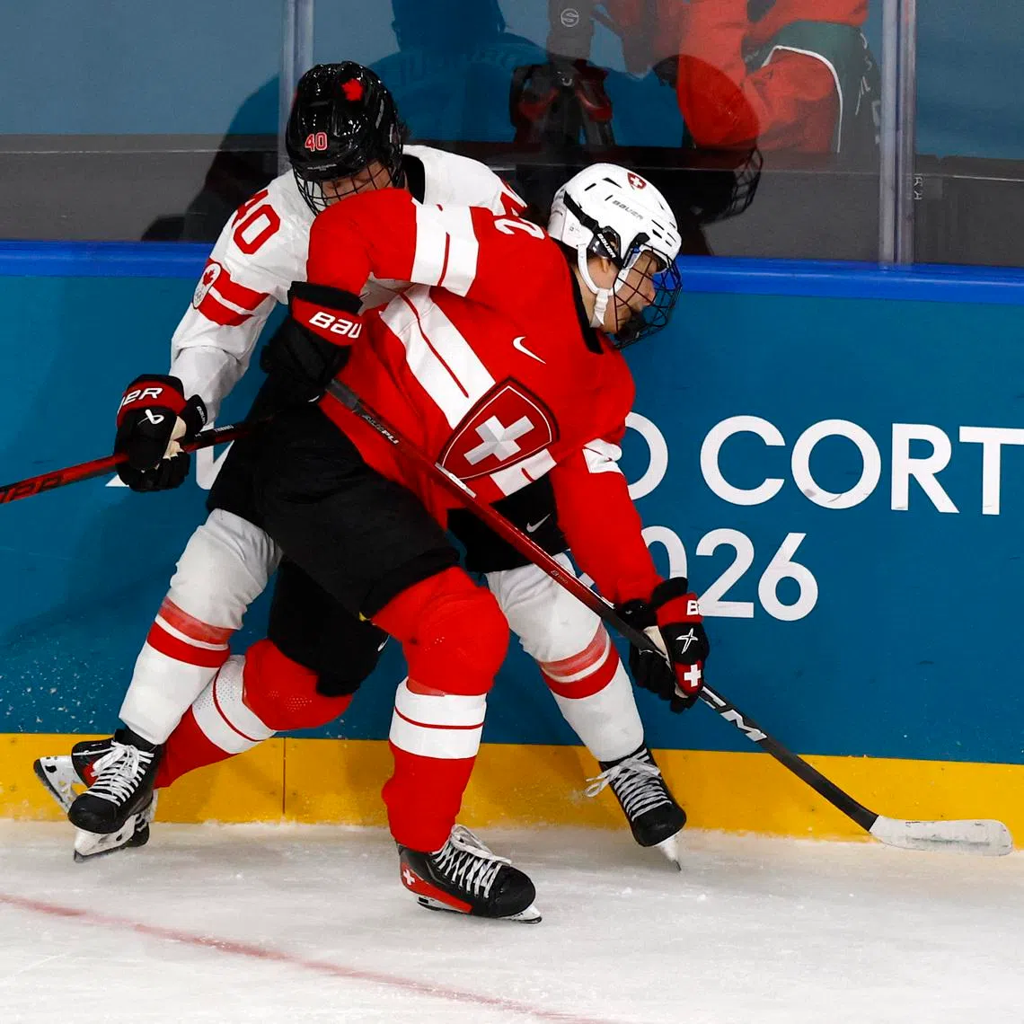 Milano Cortina 2026 Olympics - Ice Hockey - Women's Preliminary Round - Group A - Switzerland vs Canada - Milano Rho Ice Hockey Arena, Milan, Italy - February 07, 2026. Blayre Turnbull of Canada in action with Alessia Baechler of Switzerland REUTERS/Alessandro Garofalo