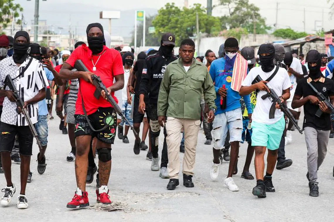 Former police officer Jimmy \"Barbecue\" Cherizier, leader of the 'G9' coalition, leads a march surrounded by his security against Haiti's Prime Minister Ariel Henry, in Port-au-Prince, Haiti September 19, 2023. REUTERS/Ralph Tedy Erol     TPX IMAGES OF THE DAY