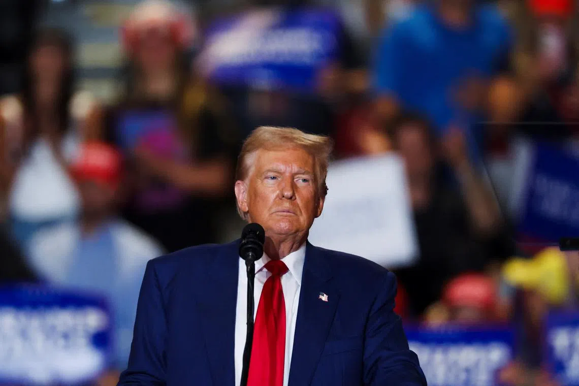 FILE PHOTO: Republican presidential nominee and former U.S. President Donald Trump looks on during a rally at Nassau Veterans Memorial Coliseum, in Uniondale, New York, U.S., September 18, 2024. REUTERS/Brendan McDermid/File Photo