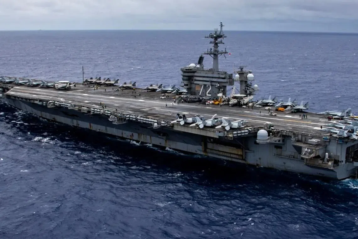 US aircraft carrier enters Middle East region as Iran warns against attack