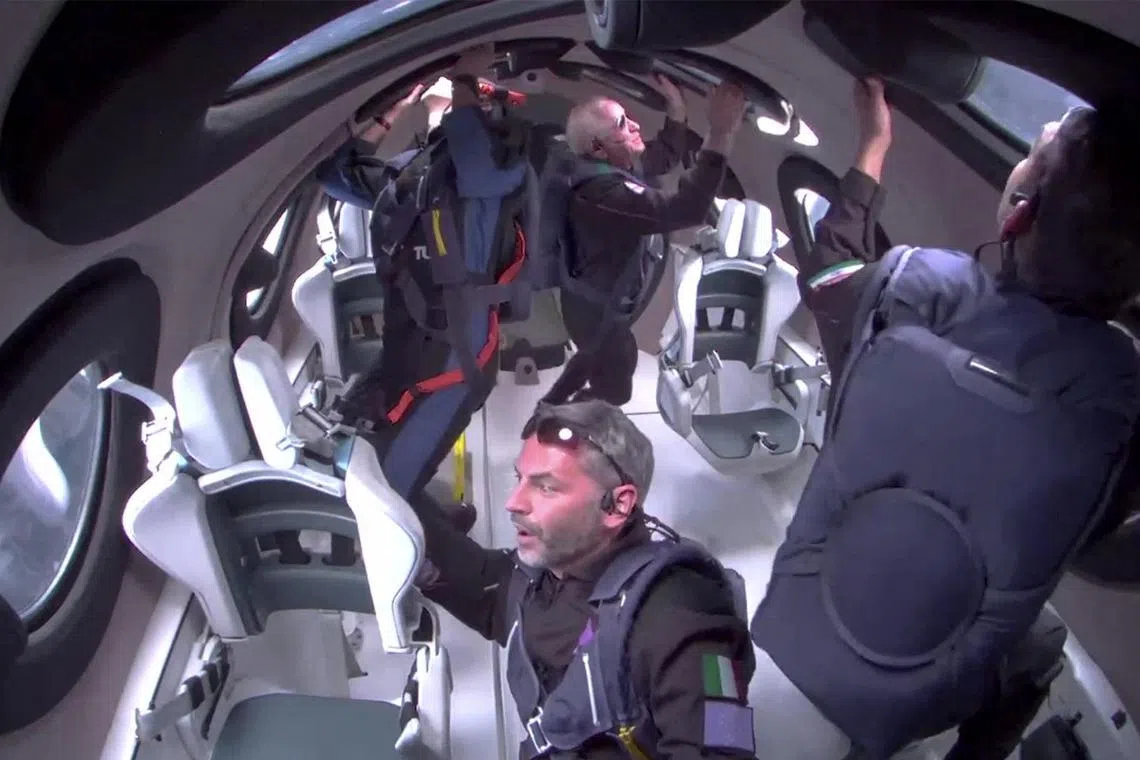 Italian investment adviser Giorgio Manenti gazes out of a window aboard Virgin Galactic's final spaceflight before it heads into a two-year hiatus. 