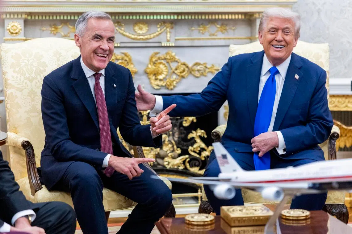 Canadian Prime Minister Mark Carney (left) meeting US President Donald Trump at the White House on Oct 7.