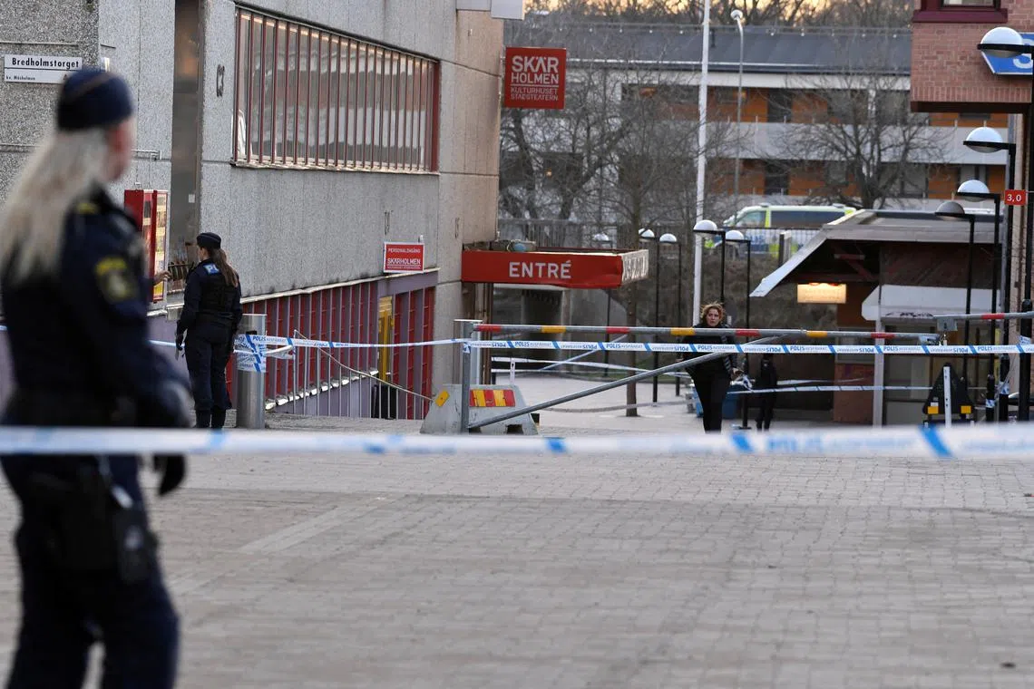 FILE PHOTO: Police officers work on the scene after a person was shot and died at Skarholmen in southern Stockholm, Sweden, April 10, 2024. Oscar Olsson/TT News Agency/via REUTERS/File Photo