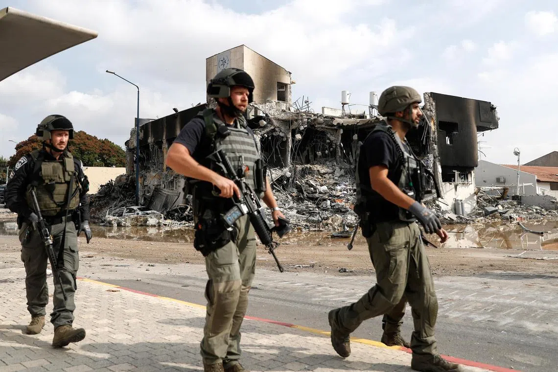 Israeli security forces patrolling near the destroyed police station that was controlled by Hamas militants in Sderot, close to the Gaza border, Israel, on Oct 8.
