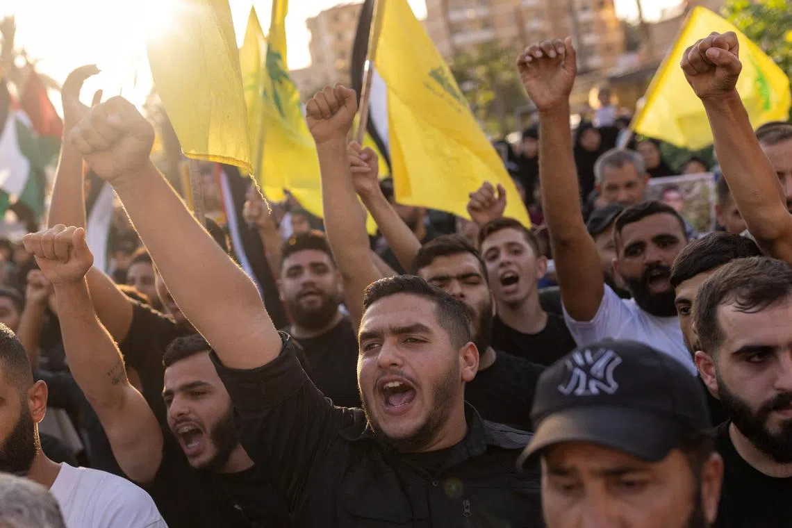 Supporters of Hamas and Hezbollah shout slogans during a protest condemning the killing of Hamas leader Ismail Haniyeh and Hezbollah top commander Fuad Shukr, in Sidon, Lebanon, on Aug 2, 2024. 
