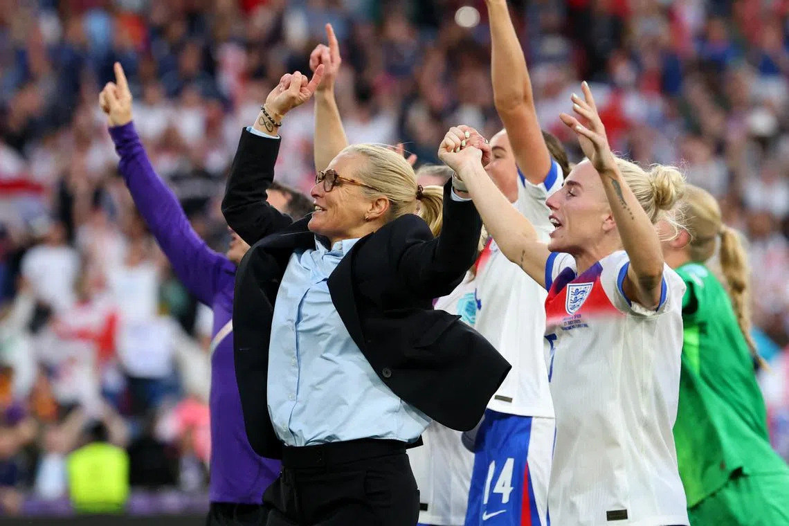 Soccer Football - UEFA Women's Euro 2025 - Final - England v Spain - St. Jakob-Park, Basel, Switzerland - July 27, 2025 England manager Sarina Wiegman with players celebrate after winning the UEFA Women's Euro 2025 REUTERS/Denis Balibouse